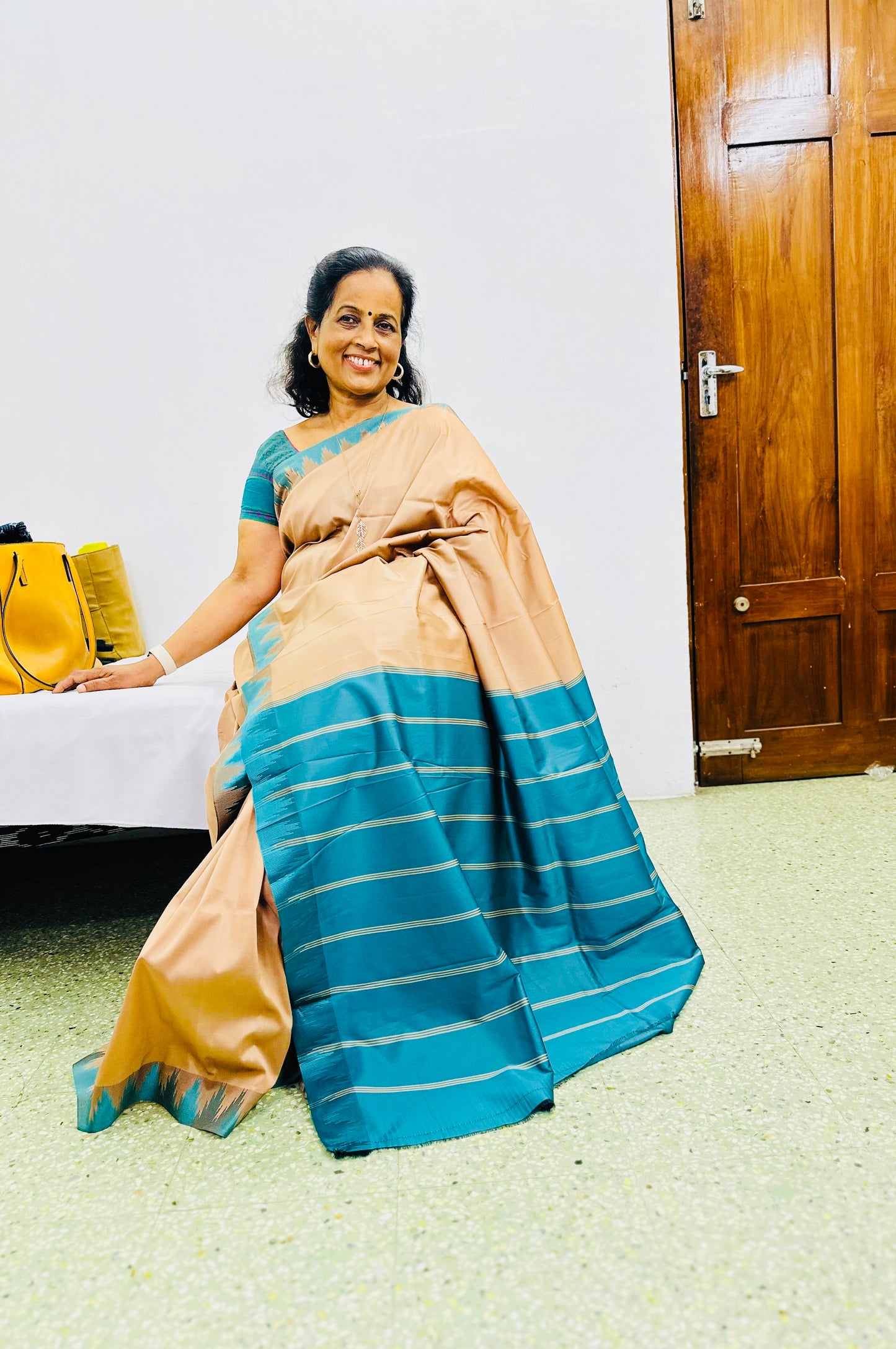 Ahana beige Semi soft silk saree with Teal border and Teal blouse